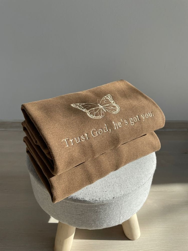 Christian Embroidered Sweatshirt – Trust God He’s Got You Quote with Butterfly, Faith-Based Brown Pullover for Women & Men